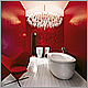 Striking Interior design of scarlet red bathroom with white plank flooring, Laufen sanitary wares & Panton Heart chair.