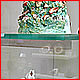 Invisible shelf supports and polished legs allows mosaic pattern to be viewed as it almost completely disappears